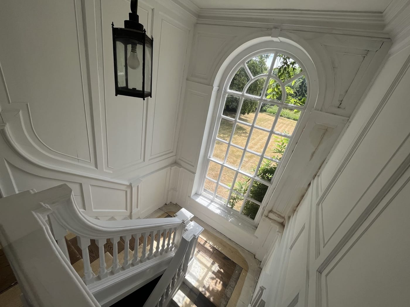 The house's Georgian staircase and arched window